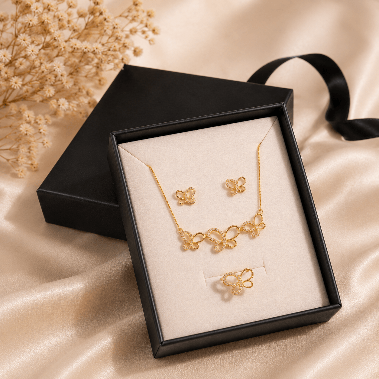 Butterfly Jewelry Set featuring a gold-plated necklace, bracelet, and earrings displayed in a black gift box.